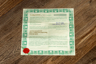 Original open punched warranty paper certificate accompanying an 18k white gold Rolex Oysterquartz Day-Date 19019