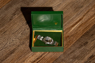 Open vintage Rolex green presentation display box housing the 1965 Rolex Explorer 1016
