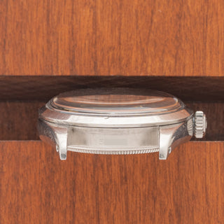 horizontal case profile showing the clean 1016 reference number engraving between the lugs of a vintage Rolex Explorer