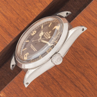 Angled top perspective showcasing the True Dome crystal profile, sharp lugs, and signed crown on a 1965 Rolex Explorer 1016