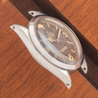 Angled top view highlighting the thick, proportioned stainless steel lug architecture on a Rolex Explorer 1016