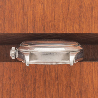 Horizontal case profile showing the clear 1.15M serial number engraving between the lugs of a 1965 Rolex Explorer
