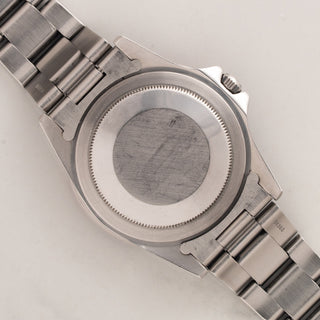 The clean stainless steel Oyster caseback and thick brushed lugs on a vintage Rolex GMT-Master 16750
