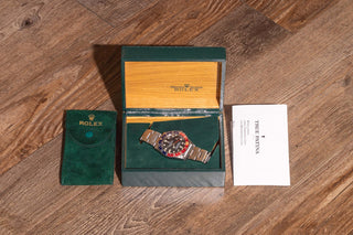 Vintage Rolex GMT-Master 16750 presentation set including original green box, service pouch, and documentation