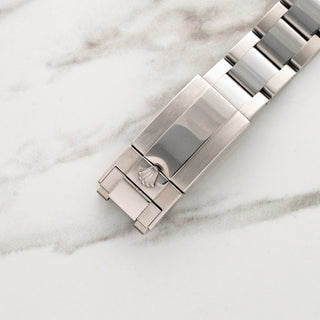 Stainless steel Oysterlock safety clasp with polished center links on a Rolex GMT-Master II 116710LN