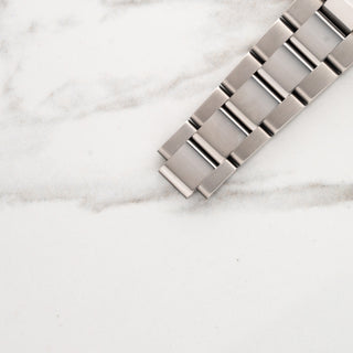 Top view displaying the solid stainless steel Oyster bracelet links with polished centers on a Rolex GMT-Master II