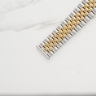 Close-up view of the two tone folded links and 455 end links on a Rolex Datejust 1601