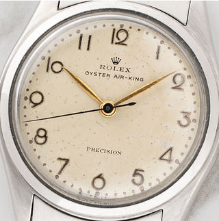 Detailed macro shot of the rare cream patina Arabic numeral dial on a vintage Rolex Oyster Air-King 4499