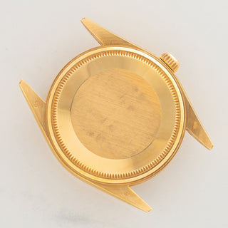 The solid 18k yellow gold Oyster caseback showing crisp factory finishing and sharp lug undersides on a Rolex 14238