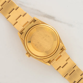 Back view showing the 18k gold 7205 rivet bracelet fitted to the Oyster caseback of a Rolex 14238