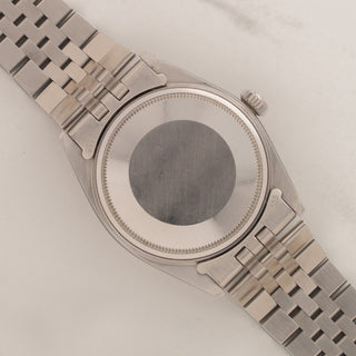 The clean stainless steel Oyster caseback and brushed lug undersides of a vintage Rolex Datejust 1600