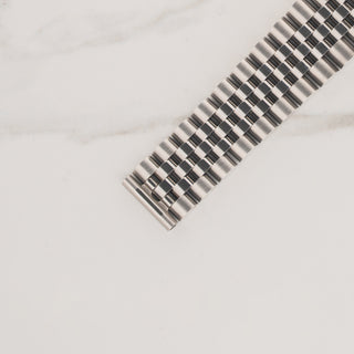 Top view displaying the five-piece link construction and 555 end links on a Rolex Jubilee bracelet