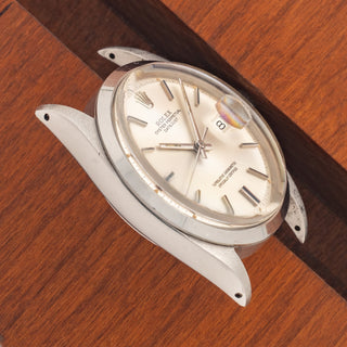 Angled top view highlighting the well-preserved case proportions and silver pie-pan dial of a Datejust 1600