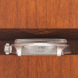 Horizontal case profile showing the smooth bezel and clear 6426 reference number engraving between the lugs