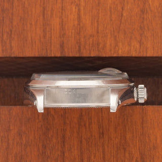 Horizontal case profile showing the smooth bezel and signed winding crown on a Rolex 6494