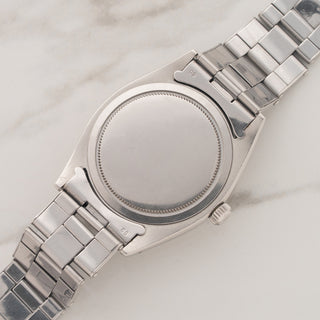 The clean stainless steel Oyster caseback and lug undersides of a vintage Rolex Oysterdate 6494