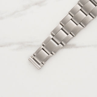 Stainless steel Rolex Oyster bracelet links attached to a vintage Air King 4499 watch