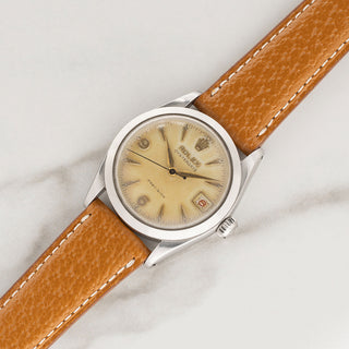 Vintage 1957 Rolex Oysterdate 6466 Honeybee watch with tropical waffle dial on a tan leather strap at Collectors Corner New York