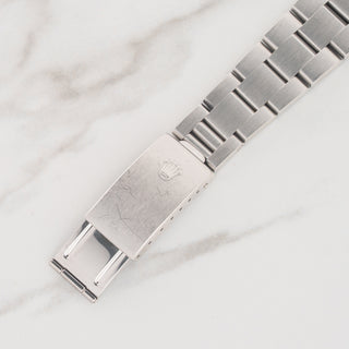 Stainless steel Oyster bracelet 78350 and closed clasp face with sharp coronet on a Rolex 6694