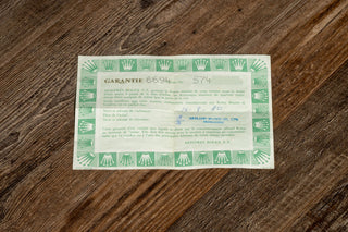 Original punched paper warranty certificate accompanying a 1980 Rolex Oysterdate Precision reference 6694