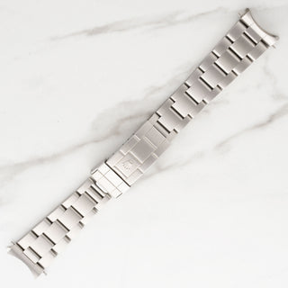 Top section of the original stainless steel Oyster bracelet attached to a Rolex Submariner 14060M