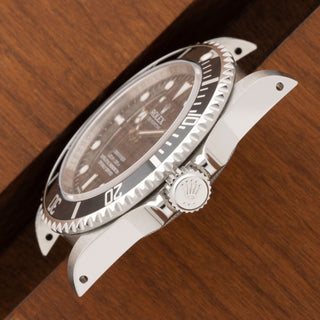 Close-up profile view of the razor-sharp lugs and bezel edge on a near mint Rolex Submariner 14060M