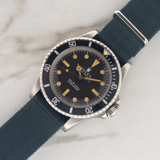 1975 Rolex Submariner reference 5513 paired with a navy blue fabric NATO strap