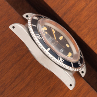 Angled top view highlighting the case lines and faded navy bezel insert on a 1975 Rolex Submariner 5513