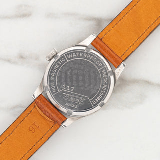 Stainless steel screw-down caseback displaying crisp Antimagnetique and Waterproof engravings on a 1940s Tissot