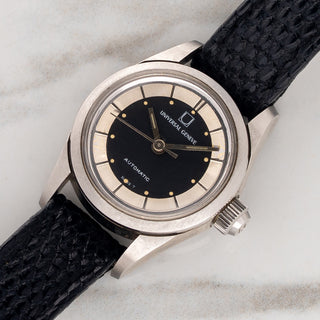 Angled view highlighting the 24mm unpolished stainless steel case and signed crystal on a ladies Universal Genève Polerouter