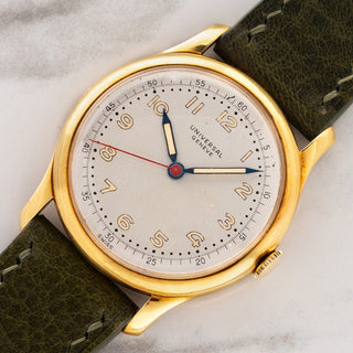 Angled shot highlighting the 18k yellow gold case, sharp lugs, and blued hands on a 1940s Universal Genève 10750