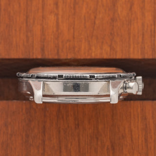 Profile view highlighting the case edge and visible serial number engraving on a Universal Genève Compax 22703