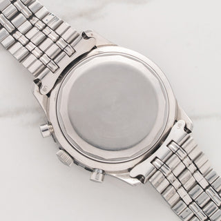Clean stainless steel caseback of a mid-1960s Universal Genève Compax chronograph