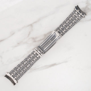 Close-up of the signed Gay Frères clasp mechanism on the stainless steel bracelet