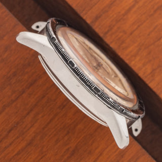 Profile view showcasing the thick lug proportions and case architecture of a Universal Genève Compax 22703