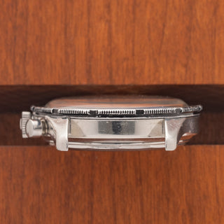 Profile view showing the case construction and visible reference number engraving on a Universal Genève Compax