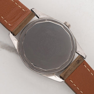 The stainless steel screw-down caseback of a Universal Genève Polerouter 20360-1 housing the caliber 215 micro-rotor movement