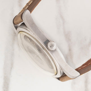 Side profile view showcasing the stainless steel case thickness and signed Universal Genève winding crown on a Polerouter 20360-1
