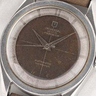 Macro close-up shot of the tropical chocolate gilt dial, crosshair pattern, and silver inner chapter ring on a Universal Genève Polerouter 20360-1