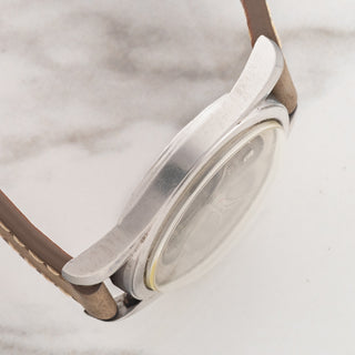 Side profile view displaying the sharp twisted lug chamfers and stainless steel case architecture on a Universal Genève Polerouter