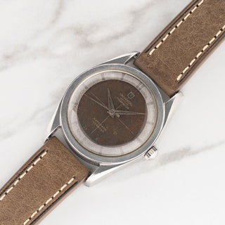 Universal Genève Polerouter reference 20360-1 with tropical chocolate crosshair dial on a brown leather strap at Collectors Corner NY