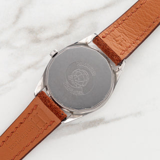 Stainless steel screw-down caseback displaying clear reference and serial number engravings on a Universal Genève Polerouter Date