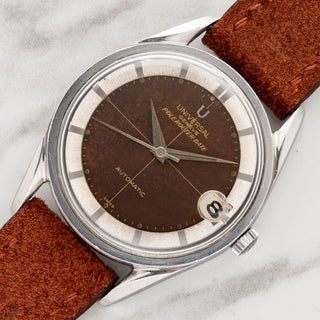 Angled shot highlighting the stainless steel case, bombé twisted lugs, silver chapter ring, and tropical dial on a Universal Genève Polerouter Date