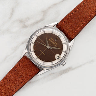 Universal Genève Polerouter Date reference 204610-2 with tropical gilt chocolate dial on a rust suede leather strap at Collectors Corner NY