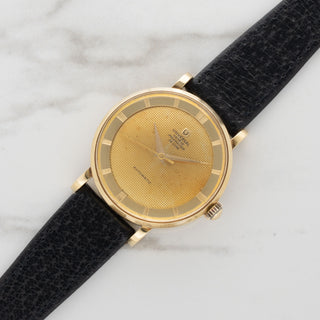 18k yellow gold Universal Genève Polerouter De Luxe reference 10234-12 with tapisserie dial on a black strap at Collectors Corner NY