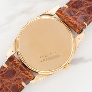 18k pink gold caseback showing crisp hallmarks and clearly legible reference 10357-2 and serial numbers on a Universal Genève