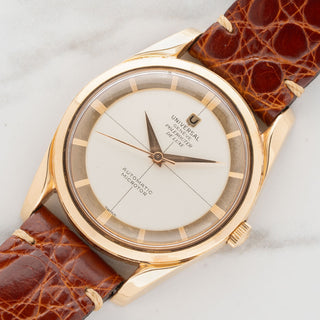 Angled shot highlighting the twisted lugs, 18k pink gold case, and non-luminous dial of a Universal Genève Polerouter De Luxe