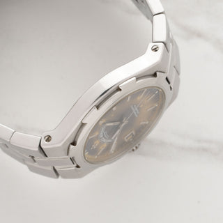 Side view displaying the slim 37mm luxury sports watch case thickness and lug integration on a Vacheron Overseas