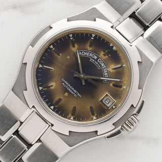 Angled shot highlighting the Maltese cross inspired bezel and unique tropical patina dial of a 1st Gen Vacheron Constantin Overseas