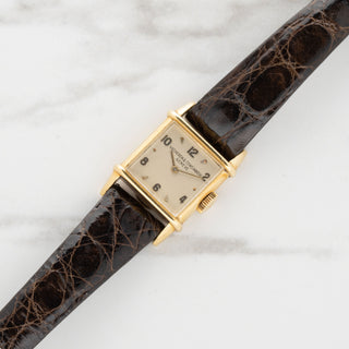 Vintage 1940s Vacheron Constantin Tank Chinoise ladies watch in 18k yellow gold on a brown alligator strap at Collectors Corner NY